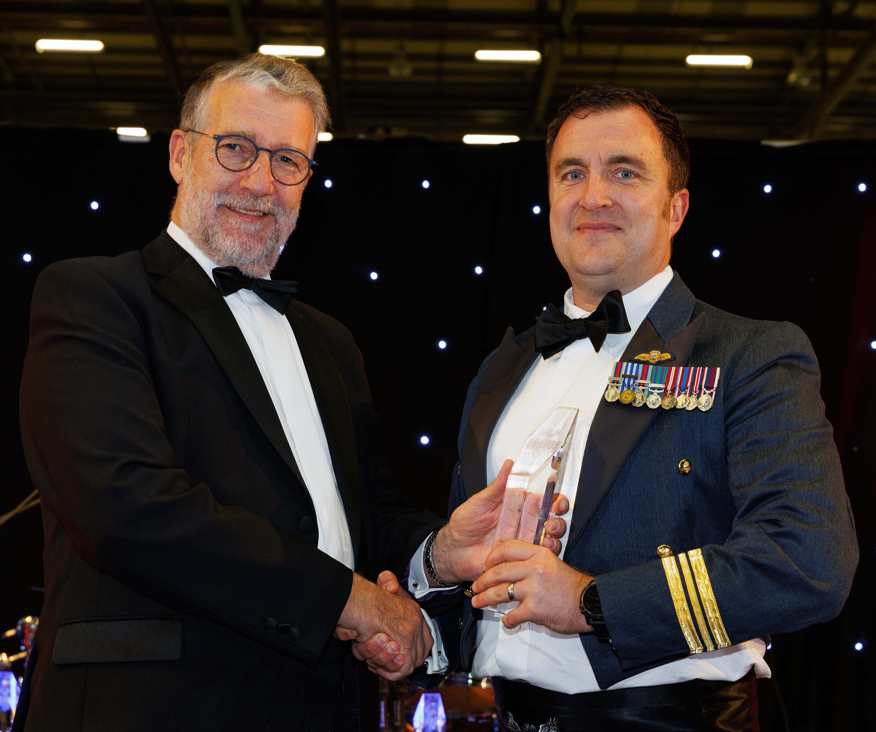 Photo: Image shows Squadron Leader Bowen receiving the Group Captain Robinson DSO MC DFC Memorial Award